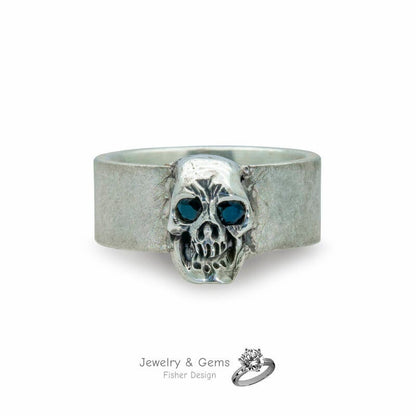 Skull ring with sapphire eyes in 925 silver